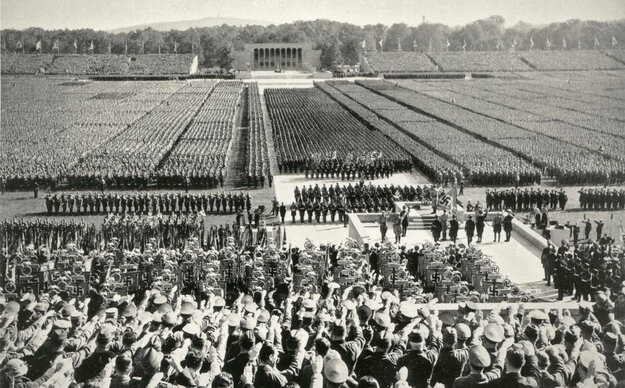 Black and white photograph of a large march on the Nazi Party Rally Grounds